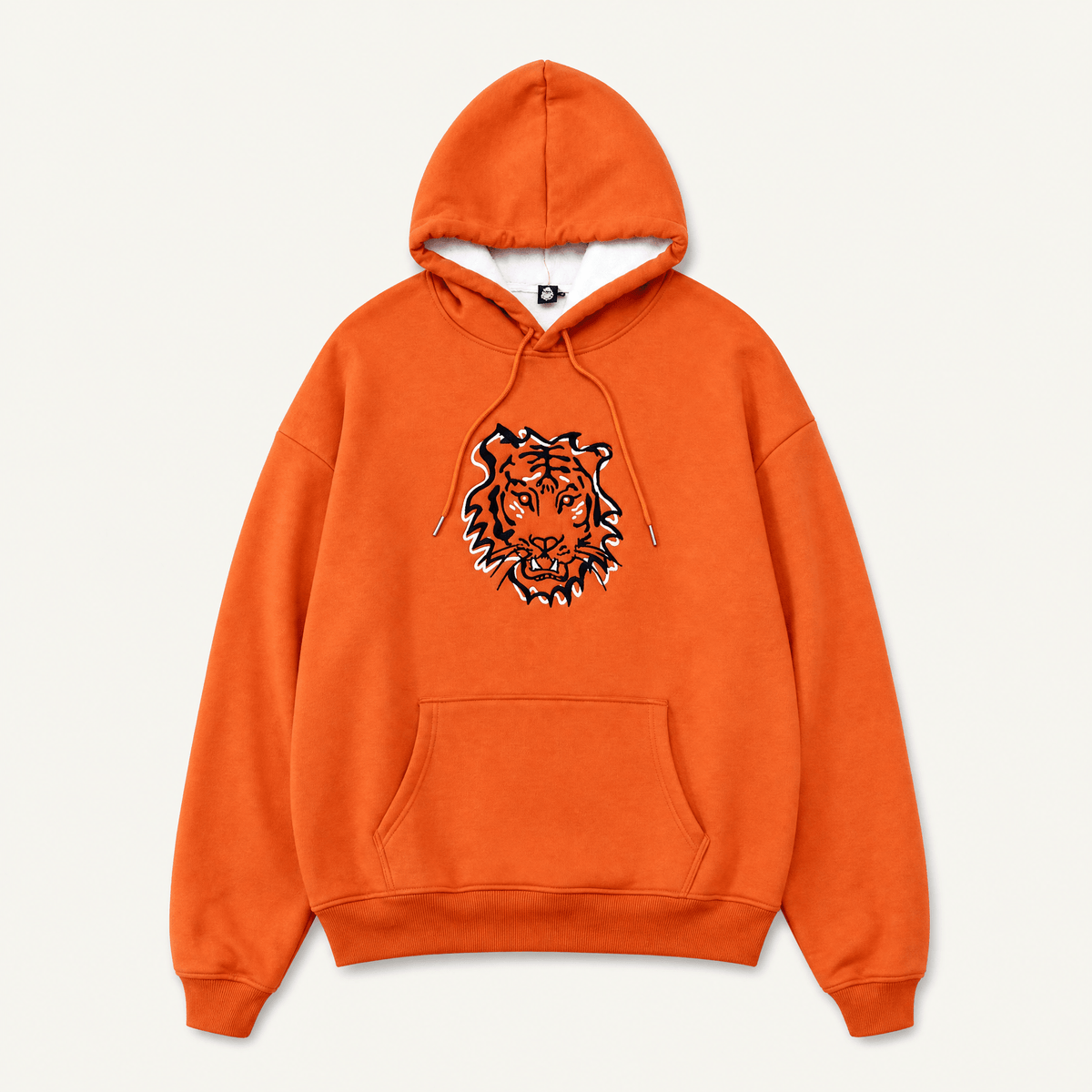 Squatchfuzz Tiger Hoodie featuring a bold tiger design on an orange background.